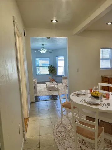 a living room with furniture and a table
