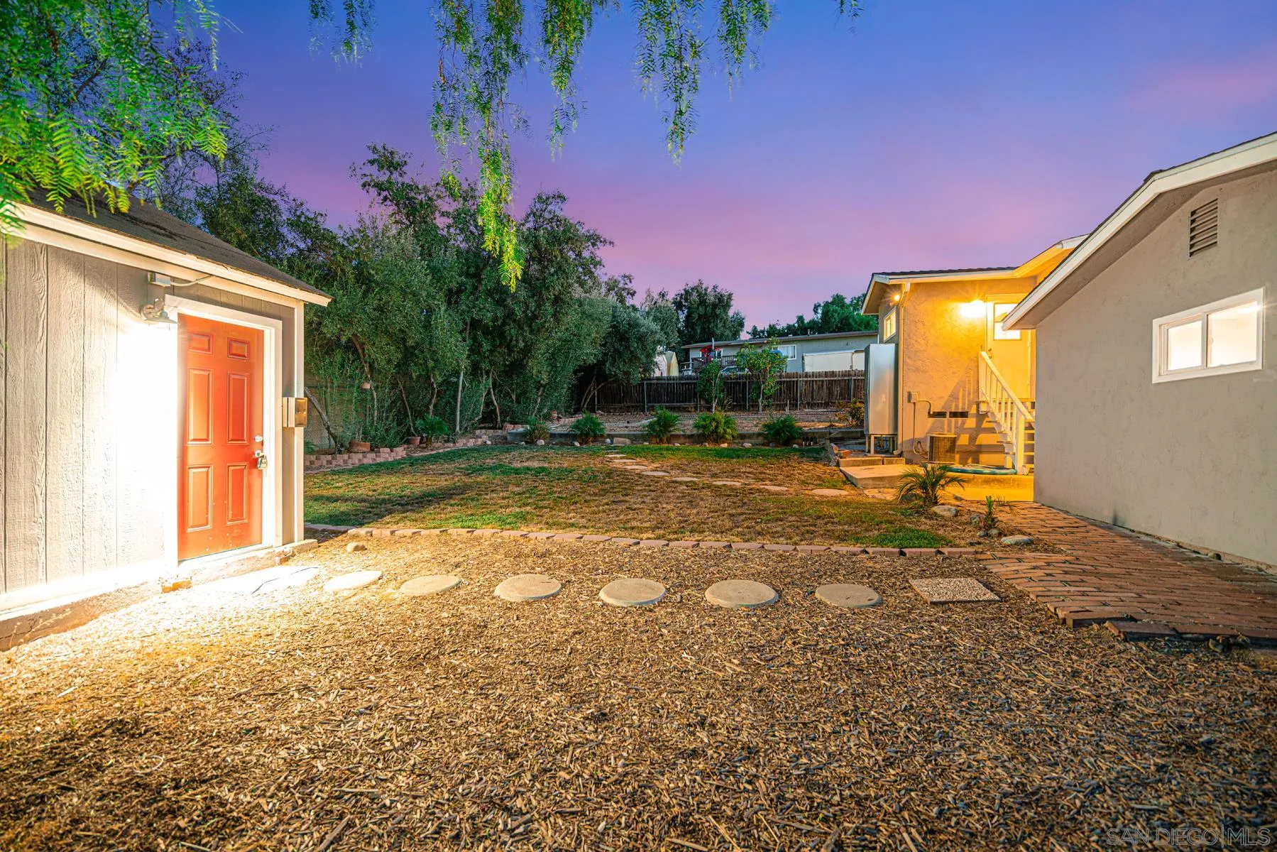 9206 Lamar Street Spring Valley, CA 91977 - Photo 3 of 21 a backyard of a house with table and chairs