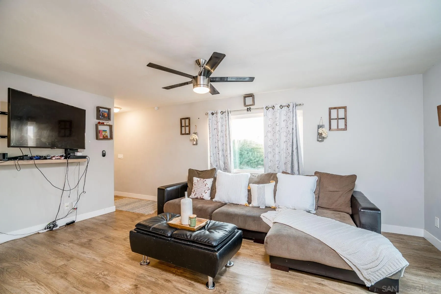 9206 Lamar Street Spring Valley, CA 91977 - Photo 9 of 21 a living room with furniture and a flat screen tv