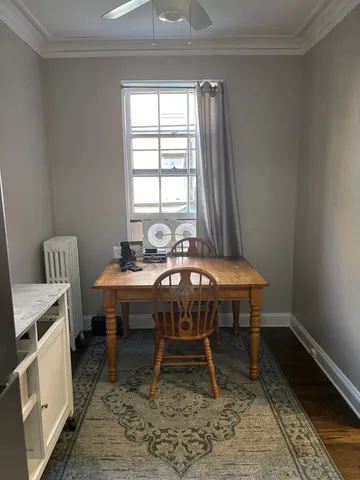 a dining room with a table and chairs