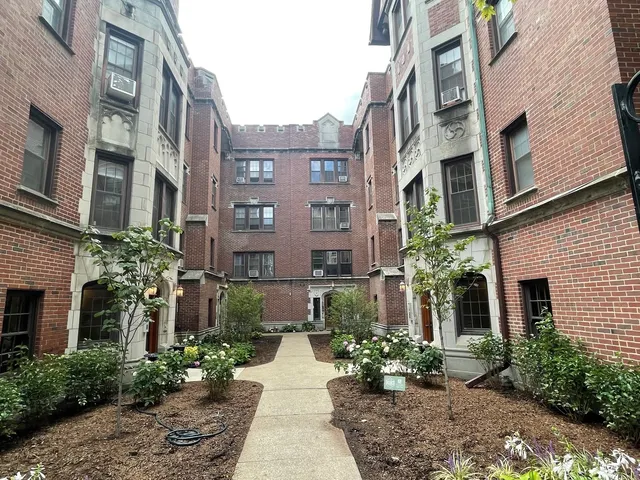 a view of a building and a yard