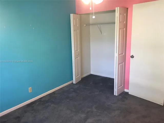 an empty room with a mirror