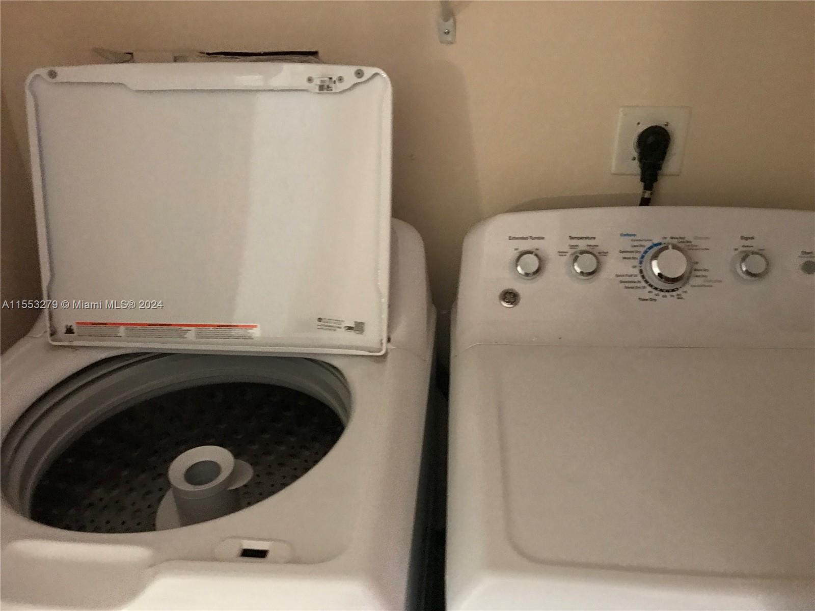 7512 Southwest 26th Court, Unit 12 Davie, FL 33314 - Photo 26 of 30 a utility room with dryer and washer