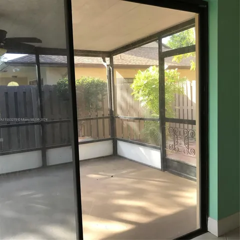 a view of empty room with floor to ceiling window