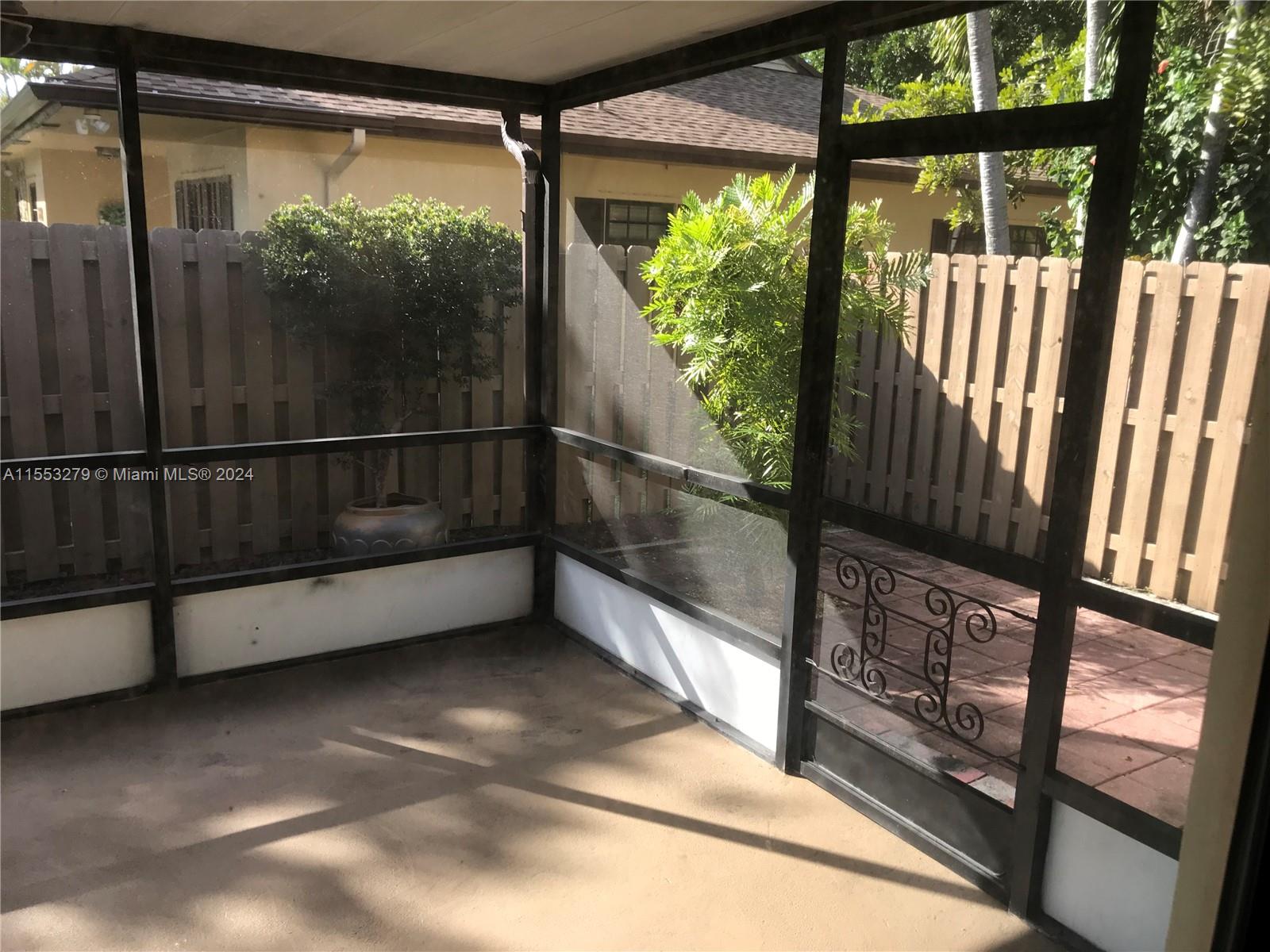 7512 Southwest 26th Court, Unit 12 Davie, FL 33314 - Photo 29 of 30 a view of a porch with wooden floor and iron stairs