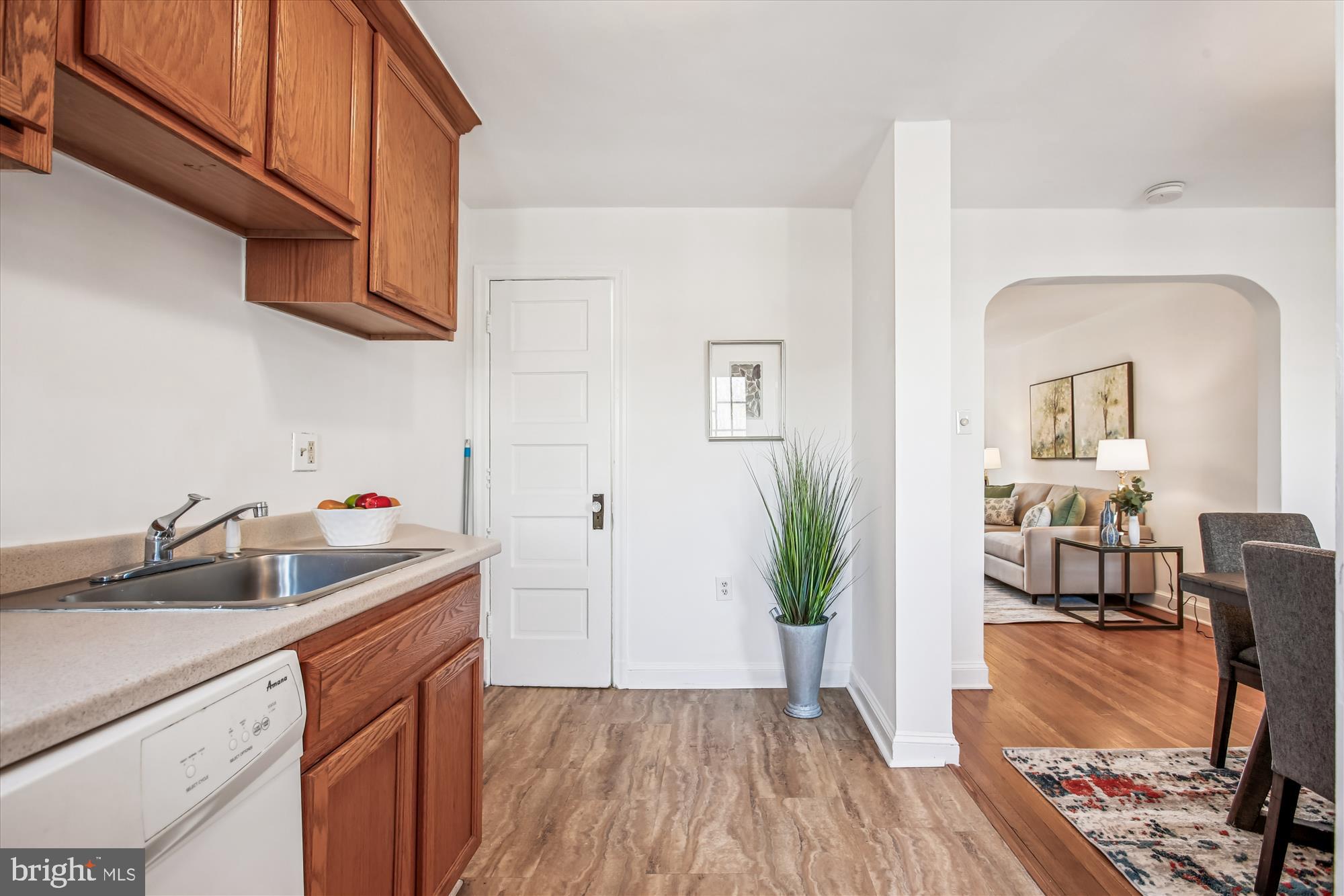 1760 E Street Northeast Washington, DC 20002 - Photo 11 of 46 a kitchen that has a sink and wooden floor
