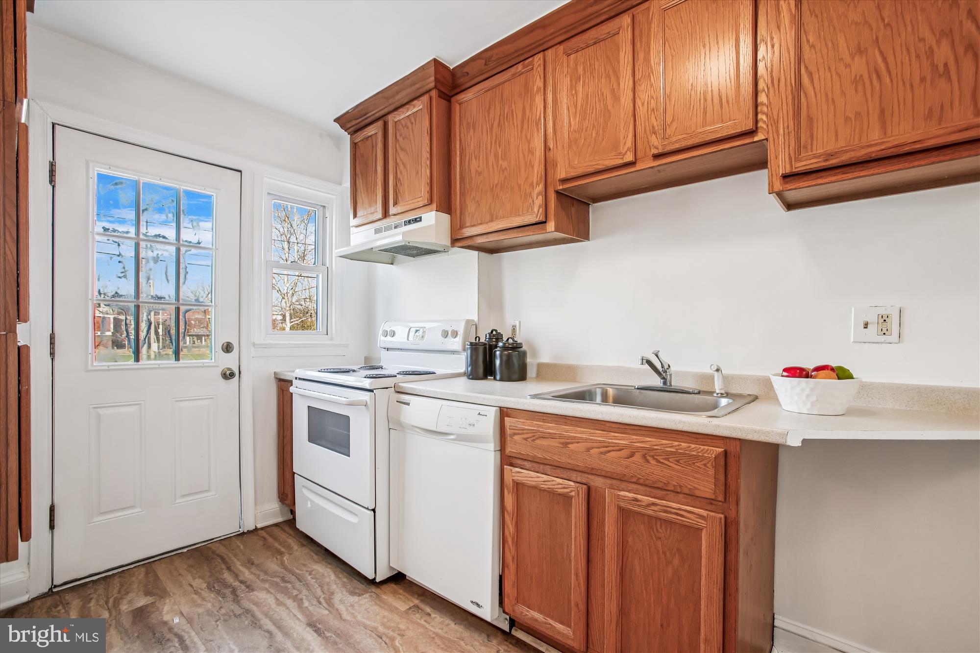 1760 E Street Northeast Washington, DC 20002 - Photo 13 of 46 a kitchen with stainless steel appliances granite countertop a sink stove and cabinets