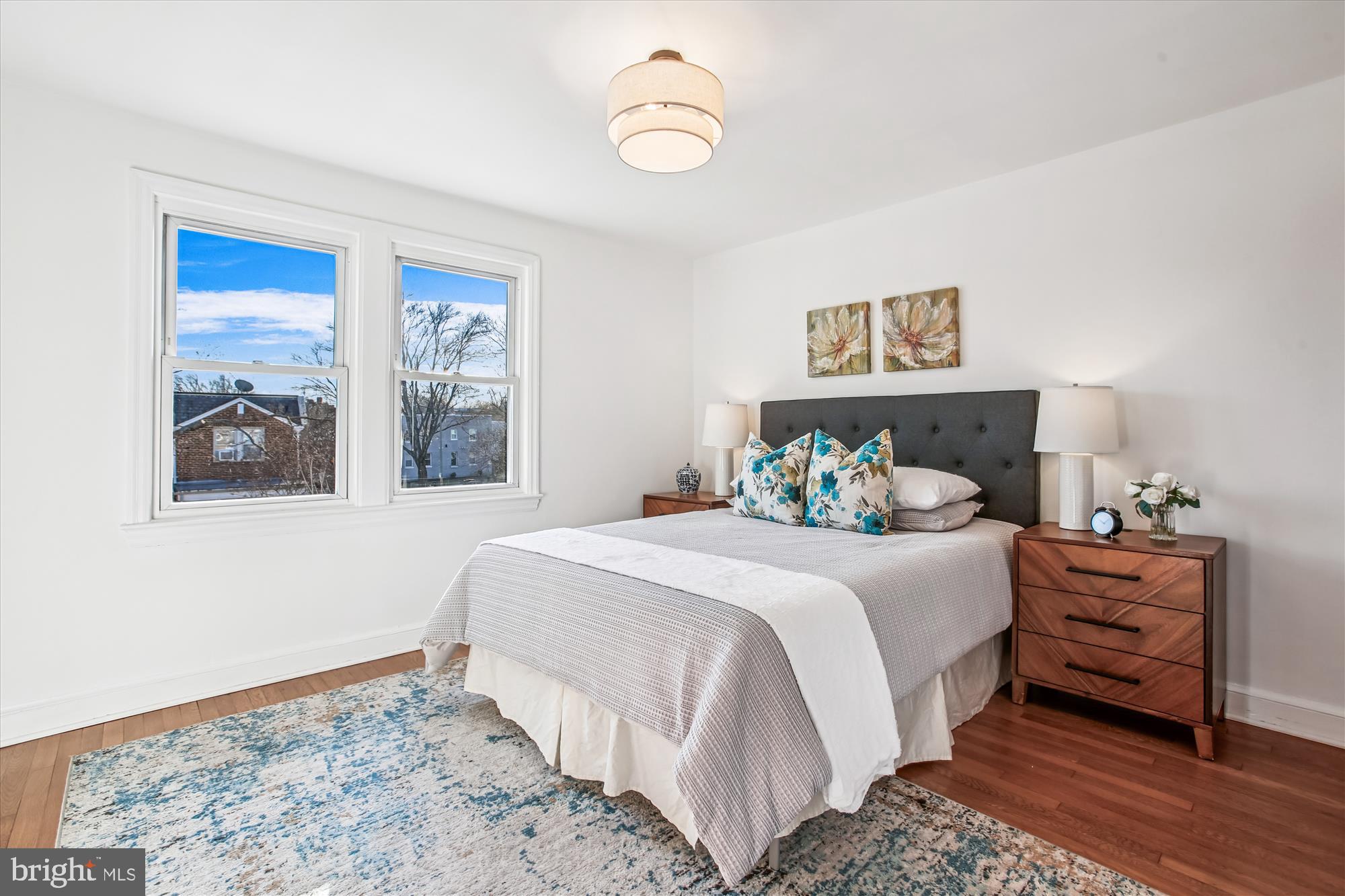 1760 E Street Northeast Washington, DC 20002 - Photo 17 of 46 a bedroom with a bed and a window