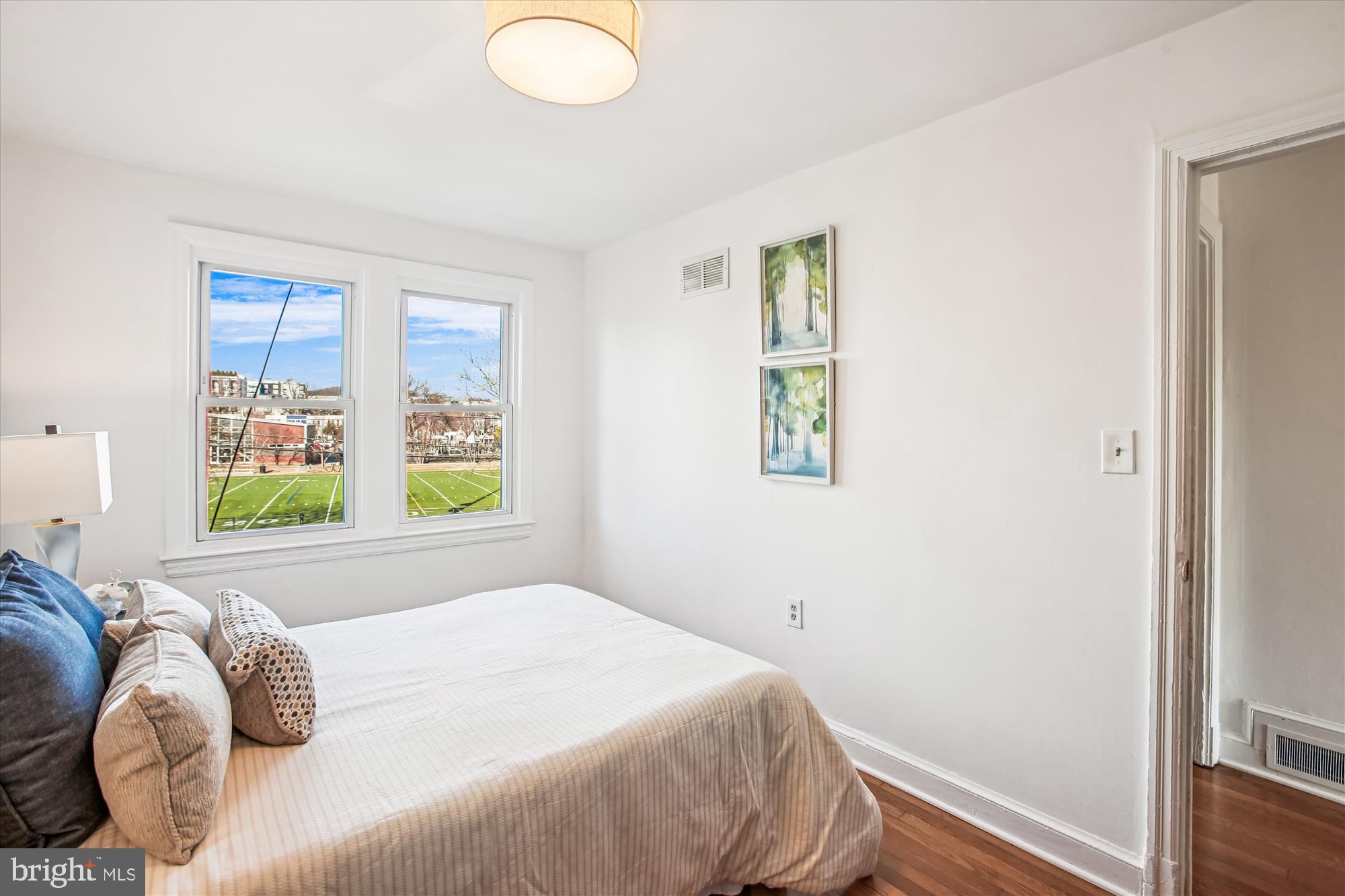 1760 E Street Northeast Washington, DC 20002 - Photo 21 of 46 a bedroom with a bed and a window