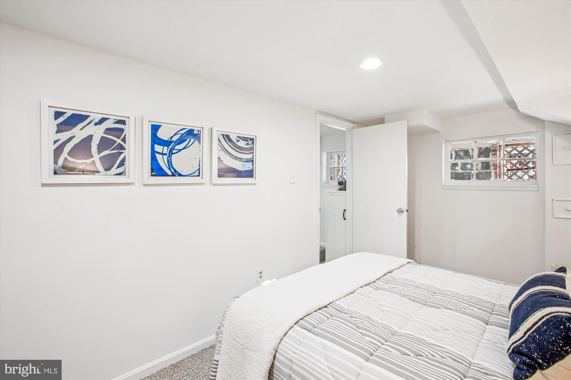 1760 E Street Northeast Washington, DC 20002 - Photo 29 of 46 a bedroom with a bed and wall painting