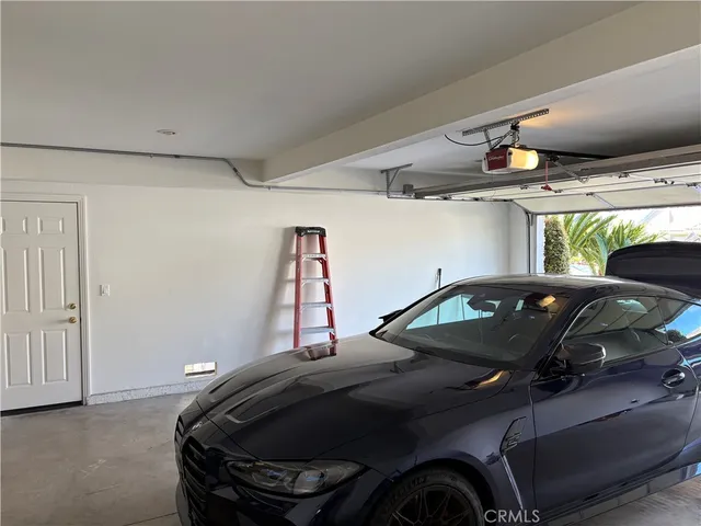 a bathroom with a granite countertop double vanity sink and a mirror