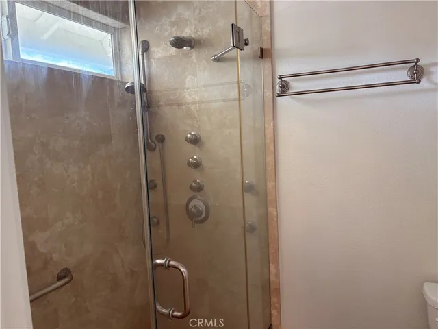 a view of an empty room and wooden floor