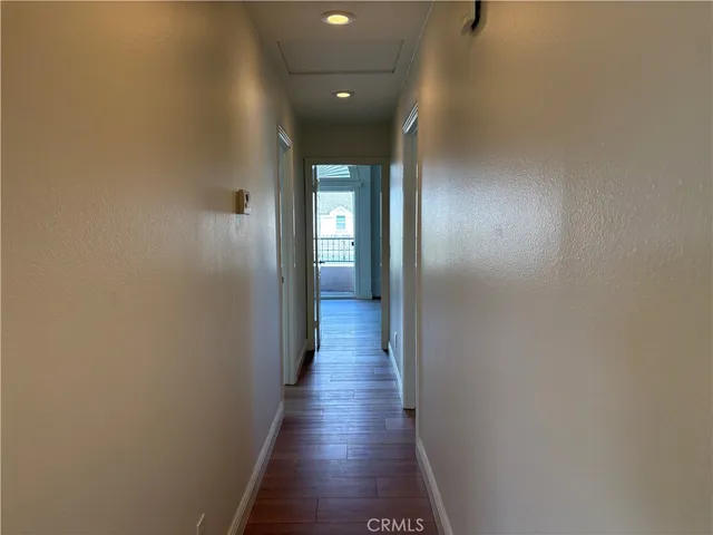 a view of a kitchen with furniture and wooden floor