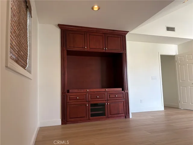 a view of a yard with yellow lighting