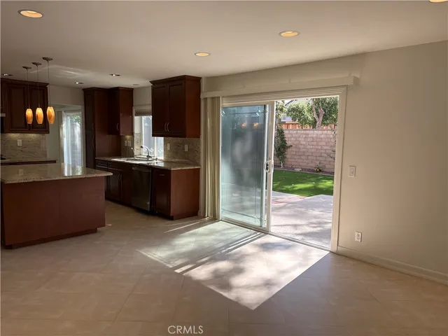 a view of staircase with wooden floor and a window