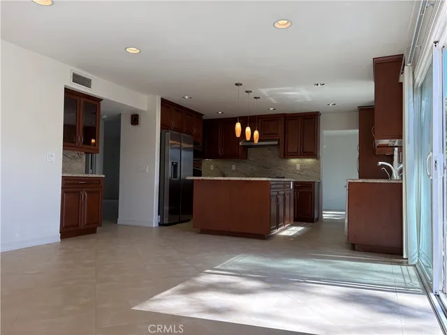 a view of staircase with railing and a window