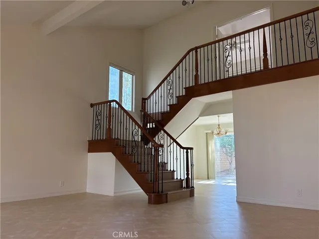 a room with window and a chandelier