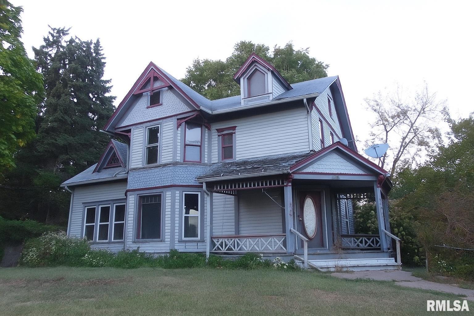 a front view of a house with garage