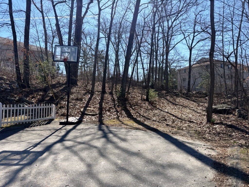 13 Pocasset Street Worcester, MA 01604 - Photo 2 of 12 a view of a yard with wooden fence