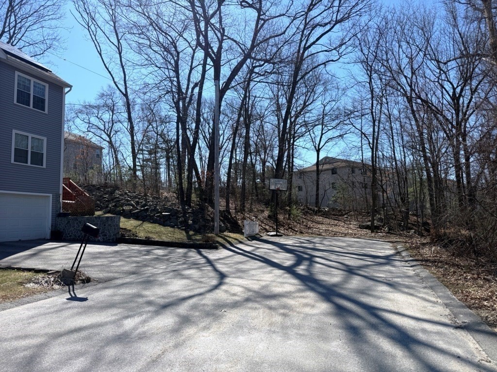 13 Pocasset Street Worcester, MA 01604 - Photo 3 of 12 a backyard of a house with table and chairs