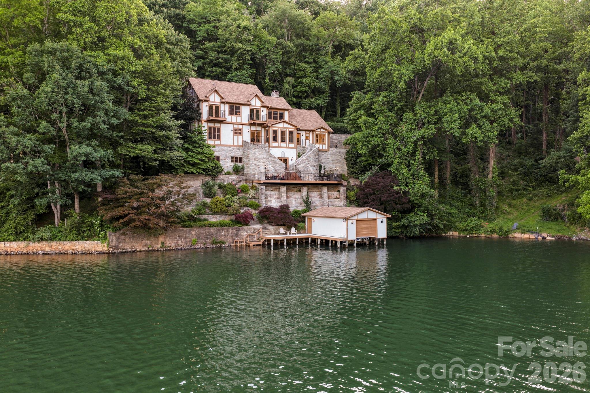 151 Garner Road Lake Lure, NC 28746 - Photo 2 of 48 a aerial view of a house with a ocean view