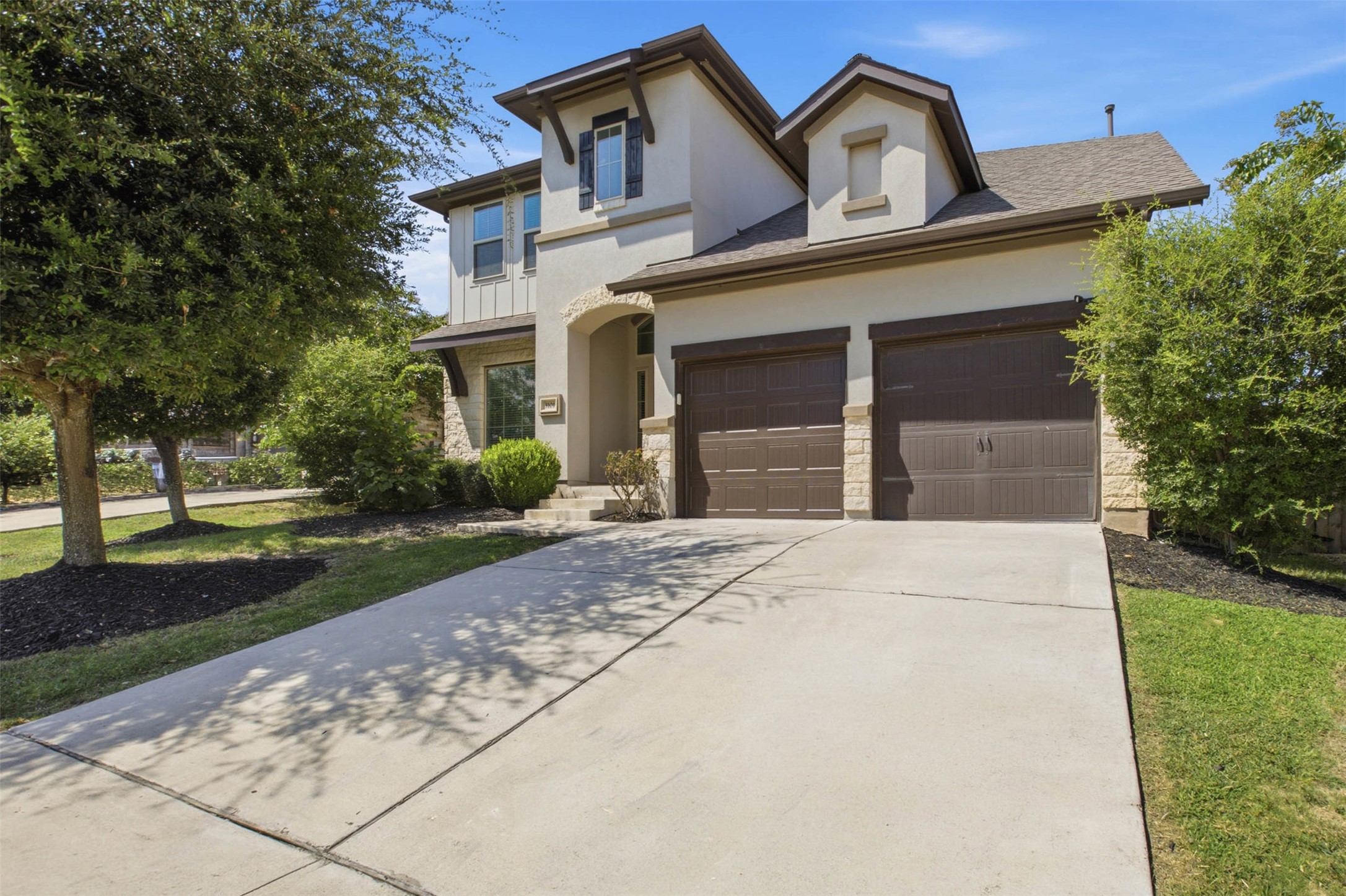 3101 Rabbit Creek Drive Georgetown, TX 78626 - Photo 3 of 38 A welcoming facade with a stone accent and mature landscaping enhances this property's charm.