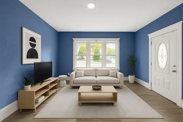 a living room with furniture and a flat screen tv