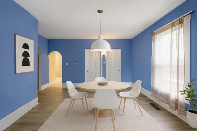 a dining room with furniture and window