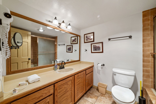 150 Ridgeview Street, Unit 117 Brian Head, UT 84719 - Photo 20 of 20 Full bathroom featuring vanity and a shower with shower door