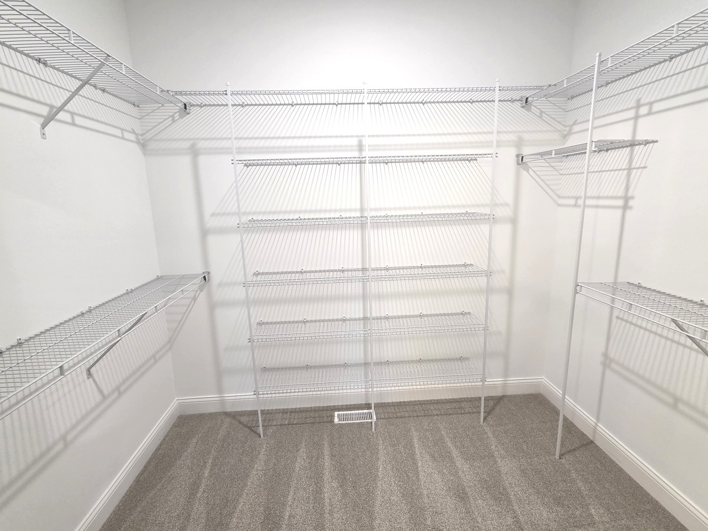 3 Saint Ivans Circle Bloomington, IL 61705 - Photo 16 of 29 a view of walk in closet with empty racks