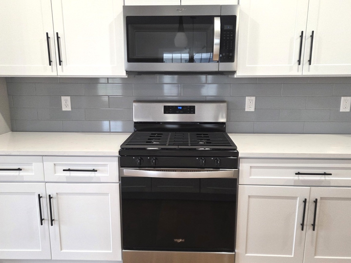3 Saint Ivans Circle Bloomington, IL 61705 - Photo 6 of 29 a kitchen with granite countertop white cabinets and black appliances