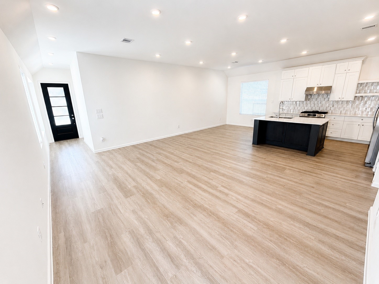 15520 Sunset Maple Court Conroe, TX 77302 - Photo 4 of 34 Living Room and Kitchen Area