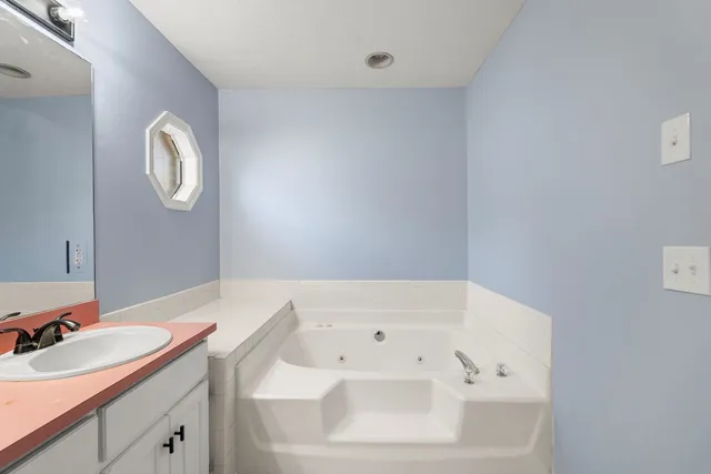 a bathroom with a sink and a bathtub