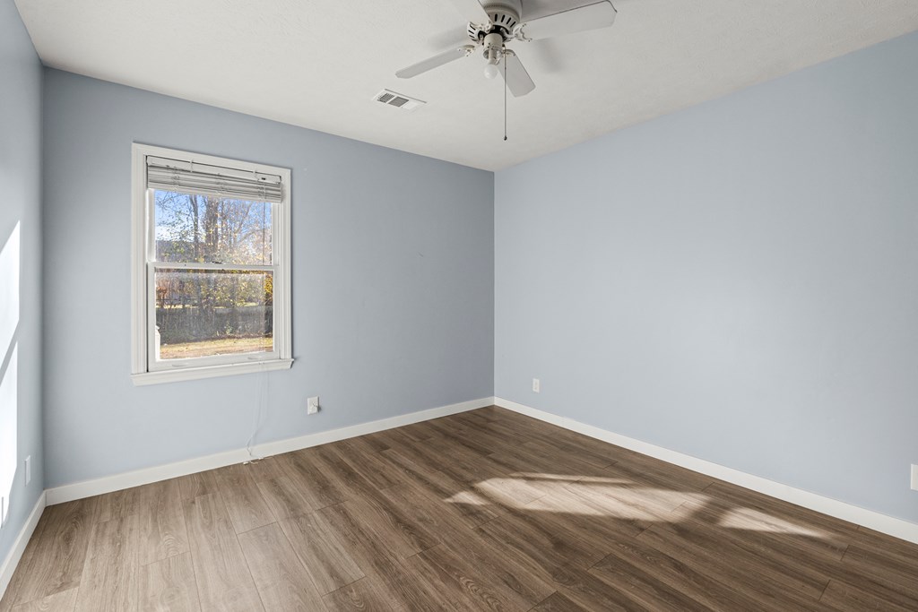 4824 Spring Ridge Court Columbus, GA 31909 - Photo 17 of 28 wooden floor in an empty room with a window