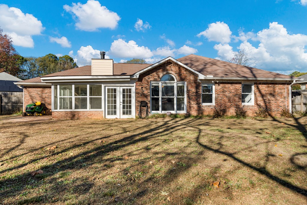 4824 Spring Ridge Court Columbus, GA 31909 - Photo 23 of 28 a view of a house with a large window and a yard