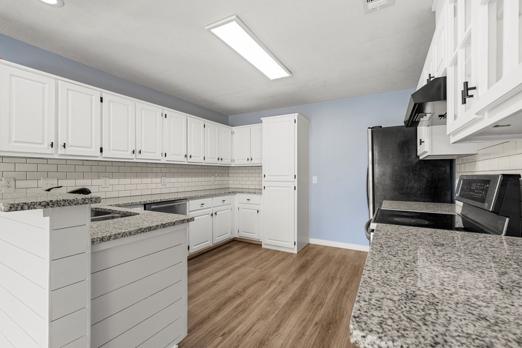 4824 Spring Ridge Court Columbus, GA 31909 - Photo 9 of 28 a kitchen with a sink stove and refrigerator