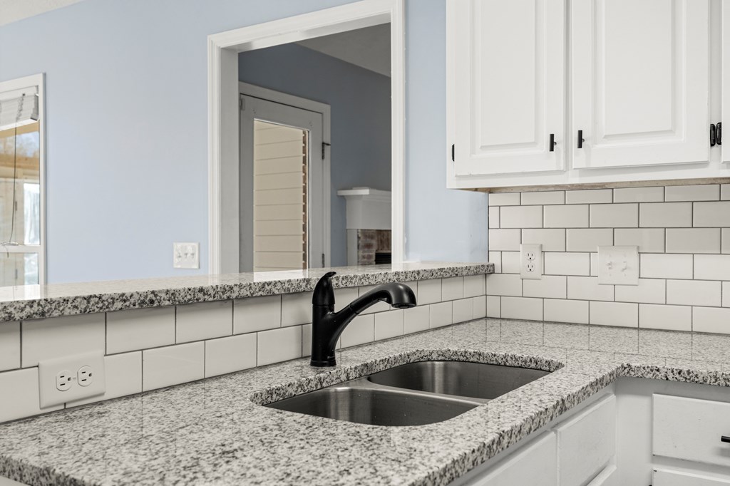 4824 Spring Ridge Court Columbus, GA 31909 - Photo 10 of 28 a kitchen with a sink and cabinets