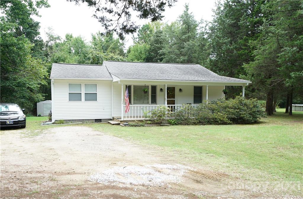 2975 Sharon Road York, SC 29745 - Photo 1 of 18 a front view of a house with a garden