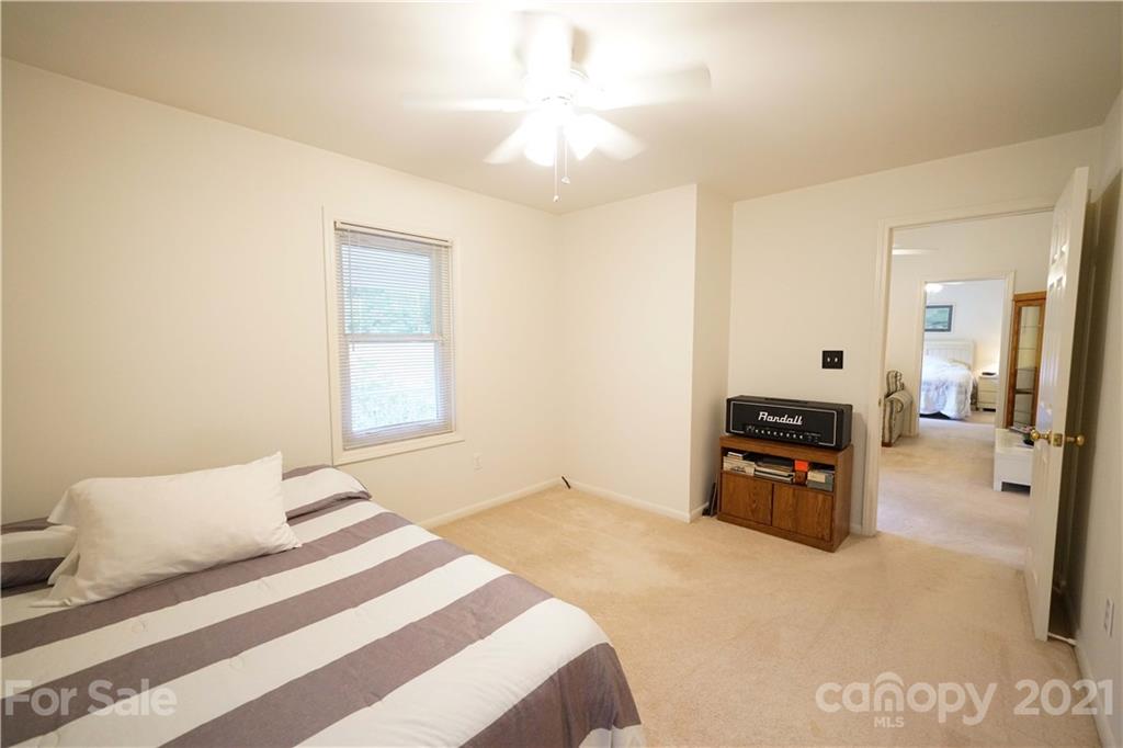 2975 Sharon Road York, SC 29745 - Photo 10 of 18 a bedroom with a bed and a chandelier