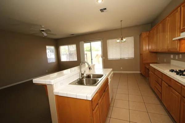 a kitchen with a sink and a stove top oven