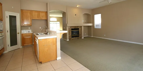 a kitchen with cabinets and a fireplace