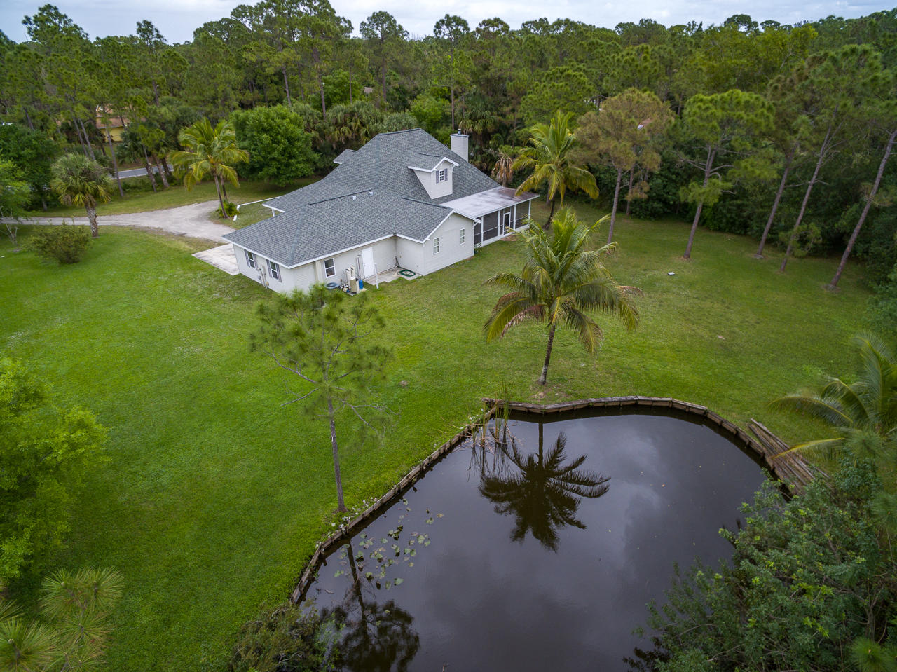 12852 175th Road North Jupiter, FL 33478 - Photo 3 of 45 Ariel Back view with Pond