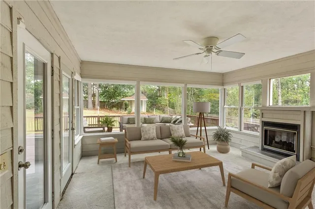 a living room with furniture and a fireplace