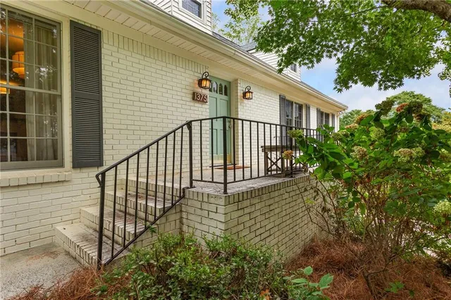 a view of a house with a small yard