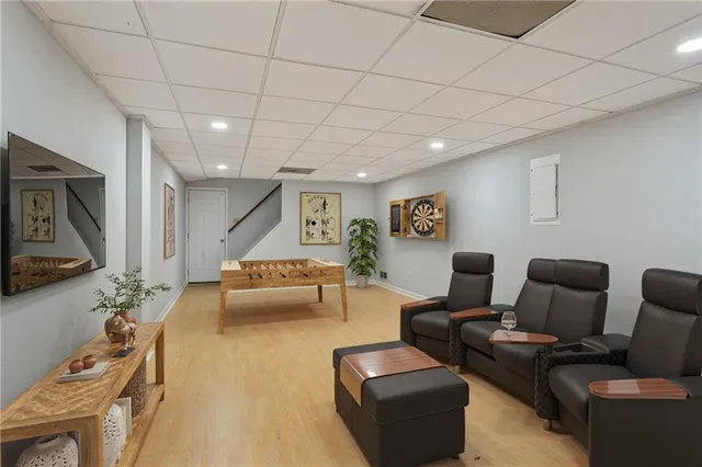 a bedroom with furniture and large windows