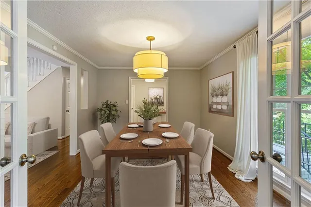 a dining room with furniture and window