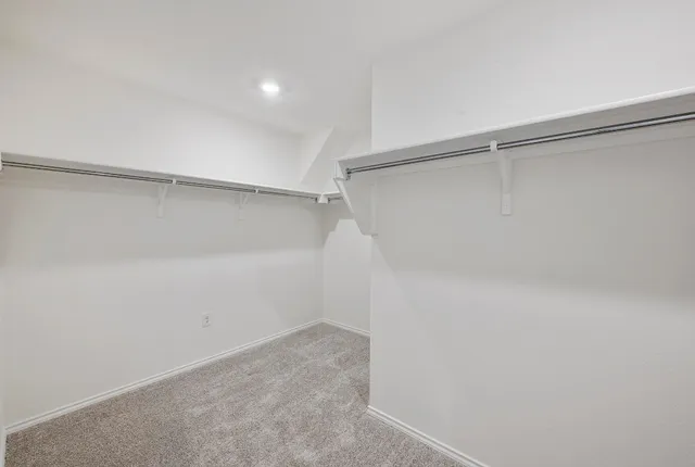 a view of an empty walk in closet