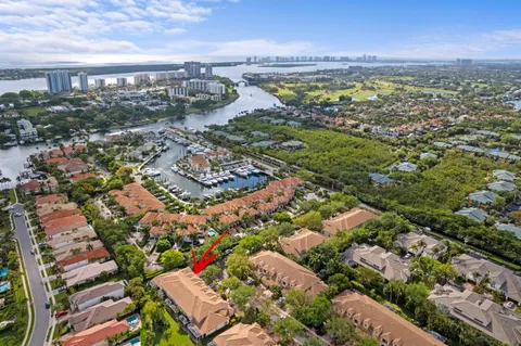 an aerial view of residential building and lake