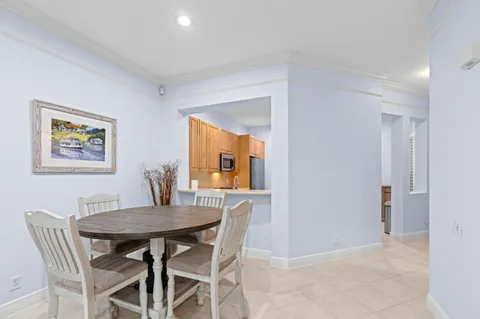 a view of a dining room with furniture and window