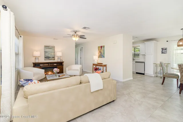 a bedroom with a bed and a ceiling fan